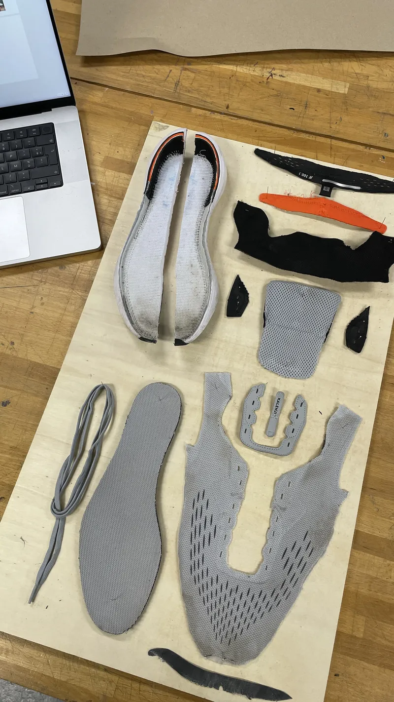 Shoe components laid out on a workbench