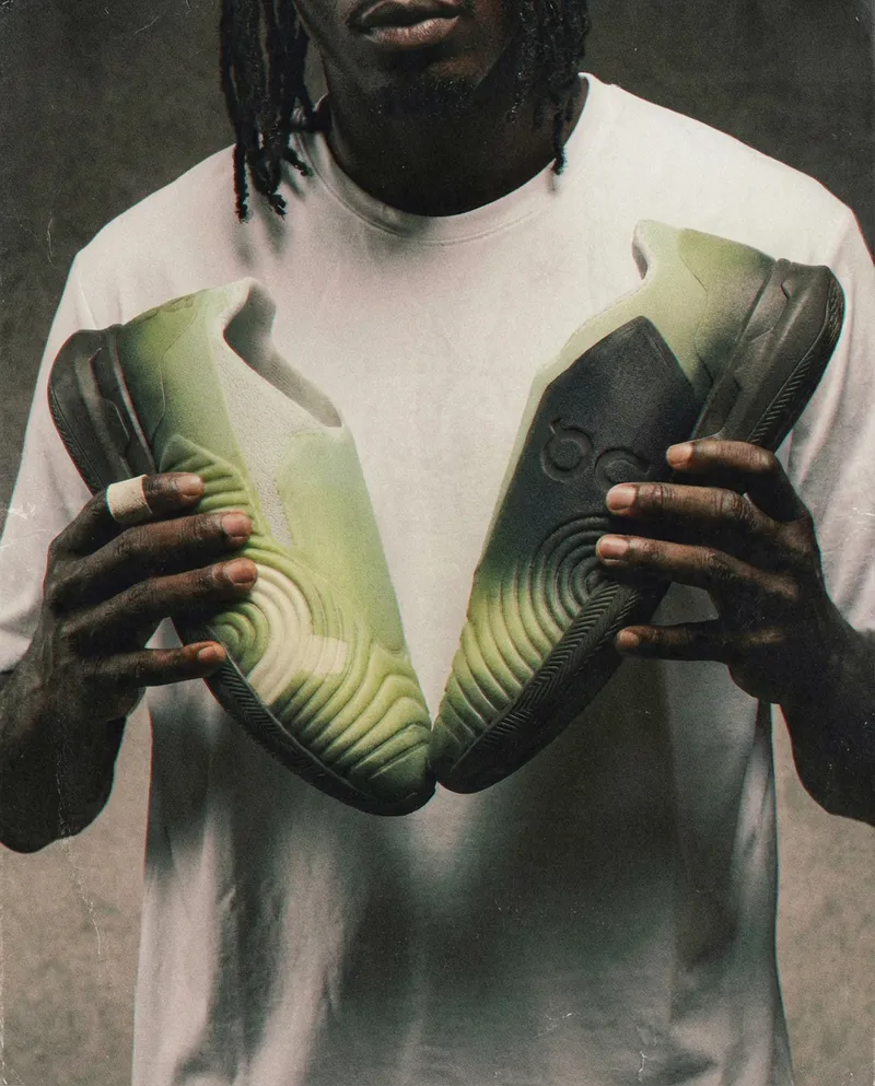 On CloudTouch shoes held in two hands