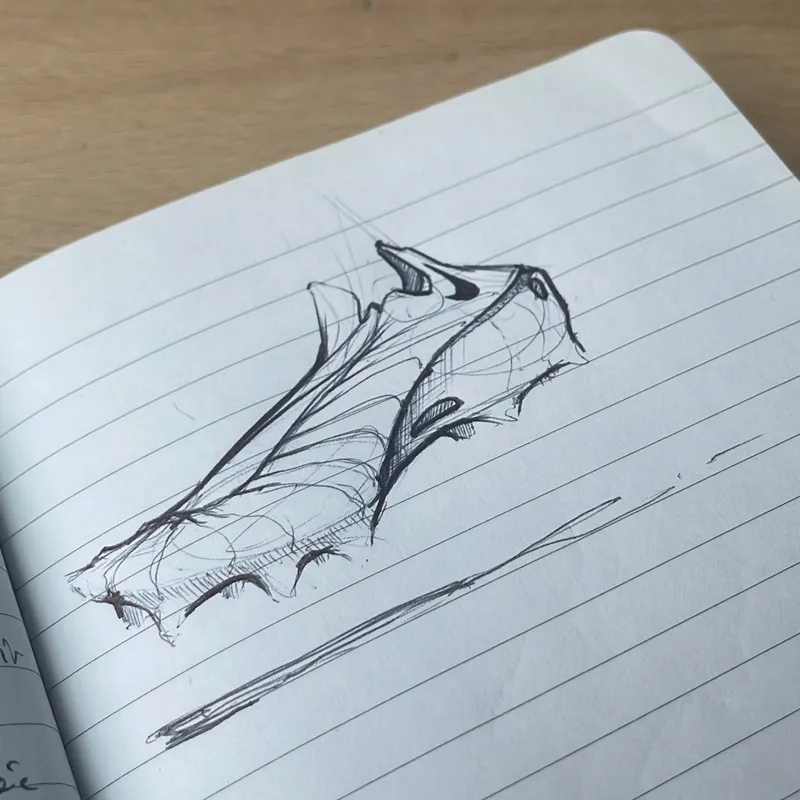 Shoe sketch in a lined notebook