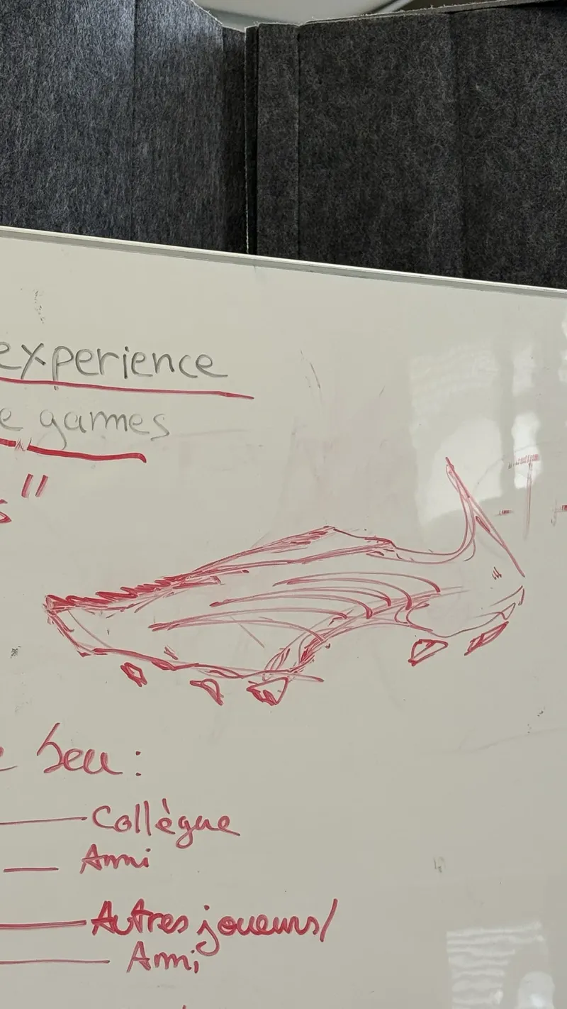 Red marker sketch on a whiteboard
